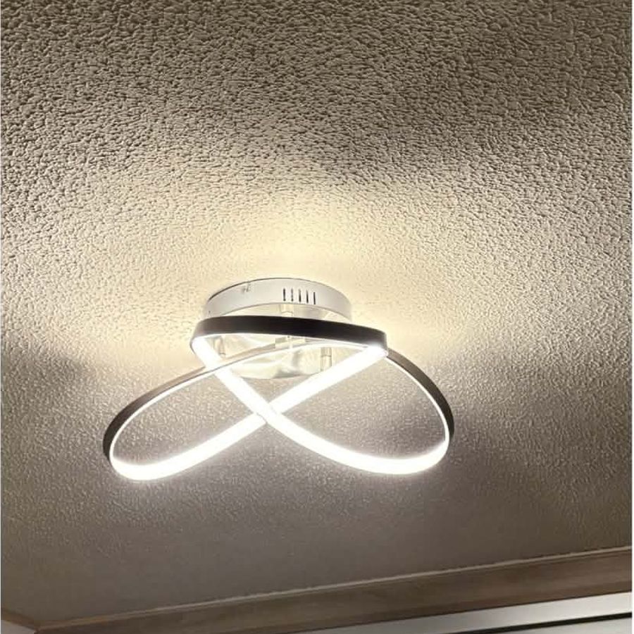 A modern flush-mounted looped LED ceiling fitting giving even light